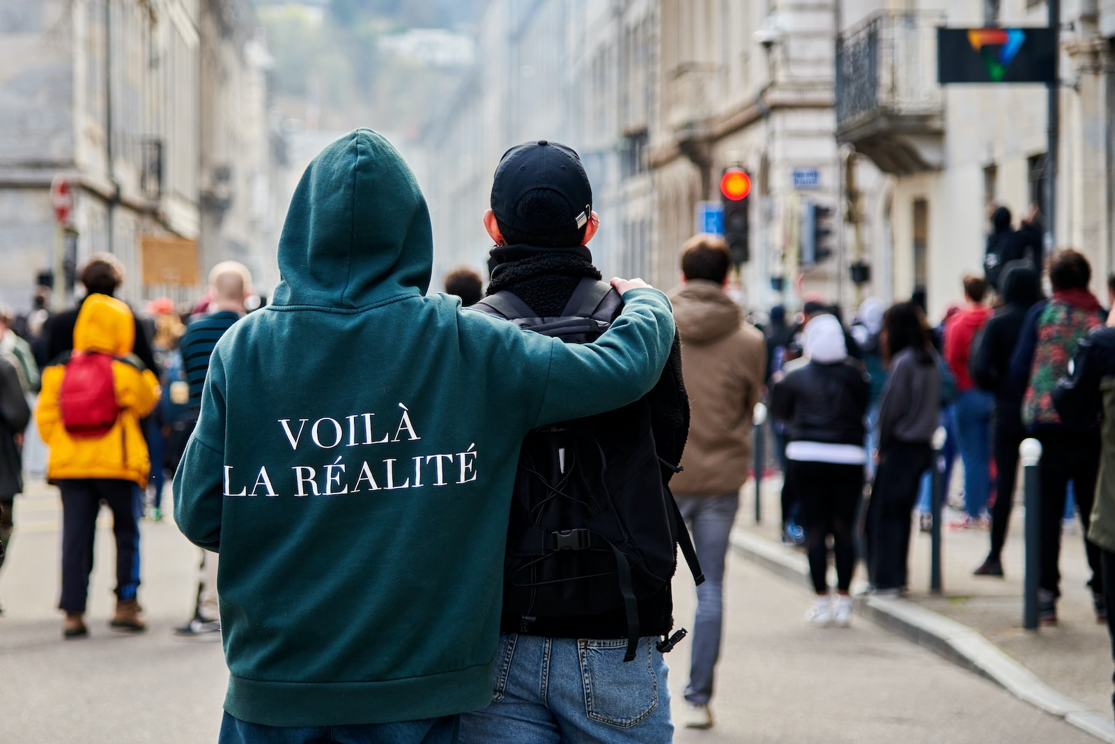 a couple of people that are standing in the street