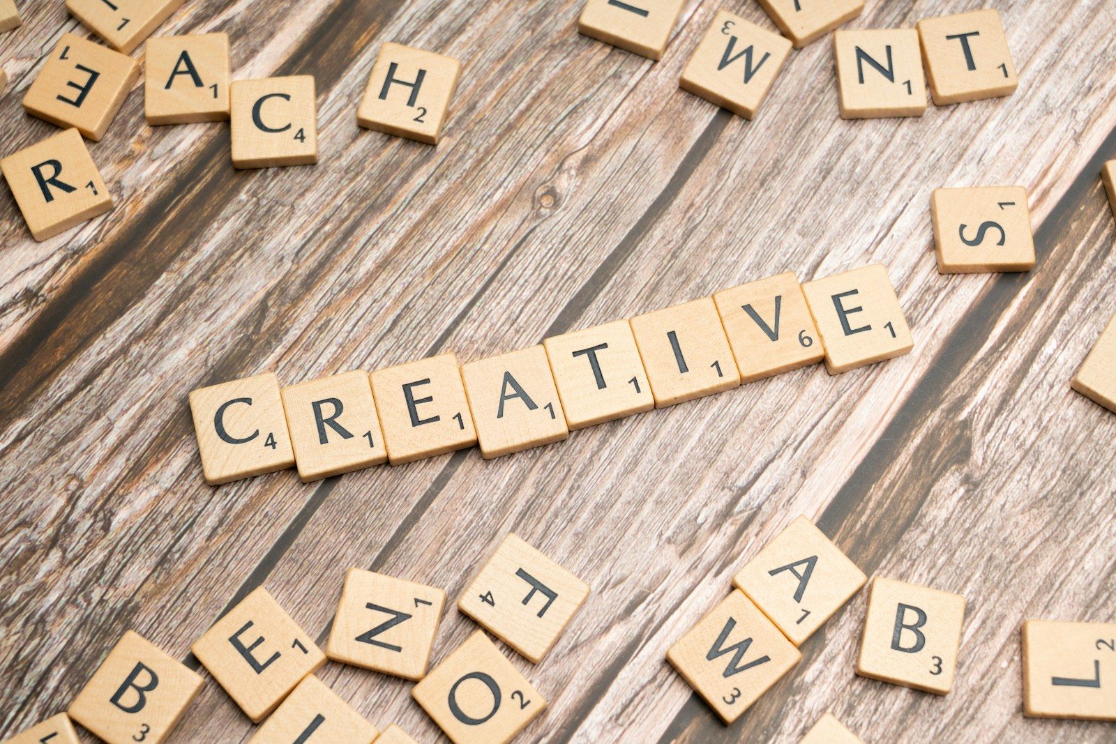 scrabble tiles spelling out the word creative