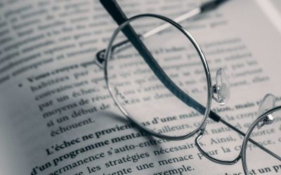 Photo by HamZa NOUASRIA a pair of glasses sitting on top of an open book