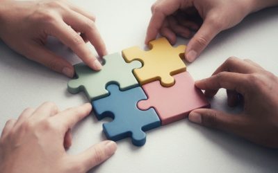 Photo by Alan Aprilio Hands connecting colorful puzzle pieces together